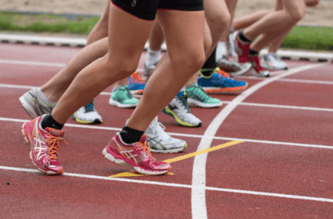 A group of people running on a track