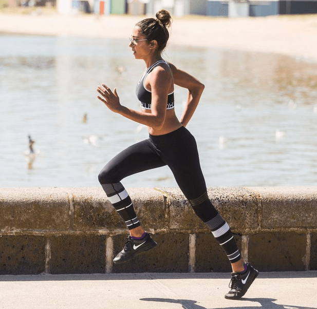 A woman running on the beach.