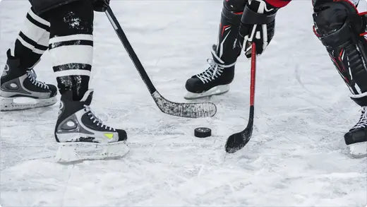 close up of skates on hockey players