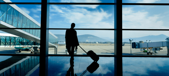 Man in an airport wearing travel socks