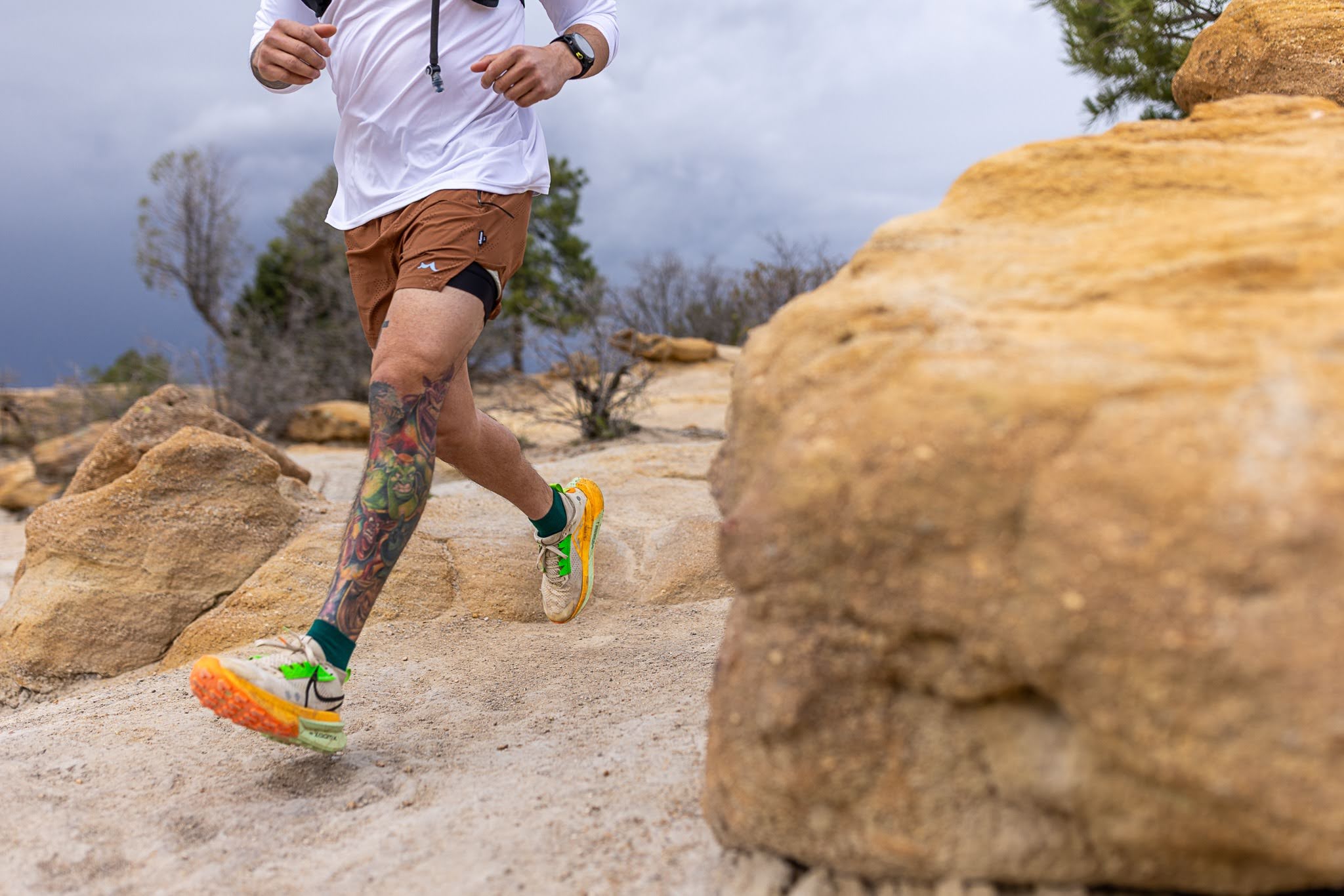 man running on a rocky trail