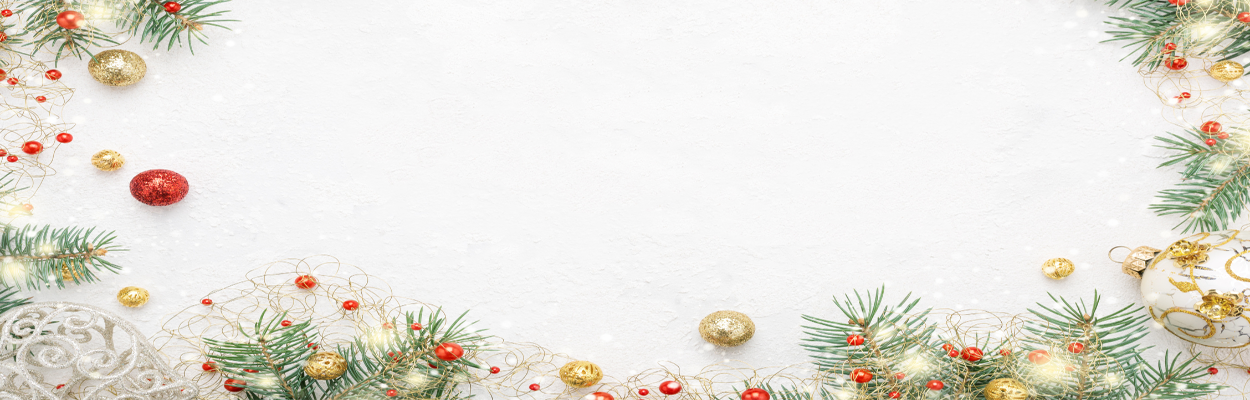 Christmas Orniments scattered on a snowy ground.