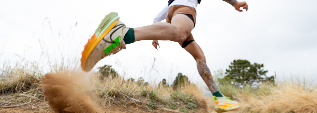 A person running and wearing Wrightsock Double Layer Running Socks.
