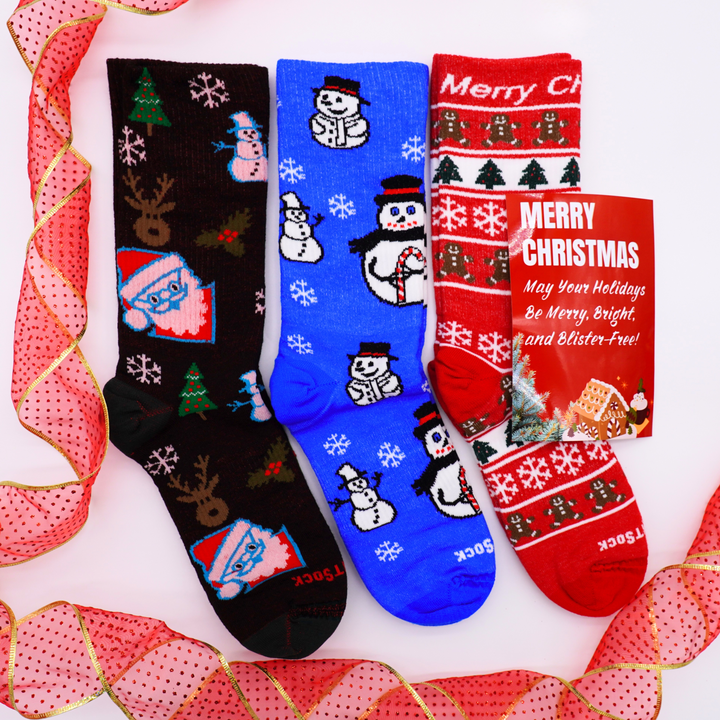 Three pairs of Explore Crew Christmas-themed socks with festive designs on a white background.