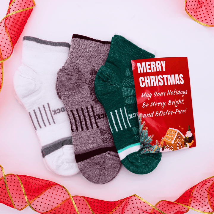 Three pairs of CoolMesh II Quarter socks with a Christmas card on a decorative background.